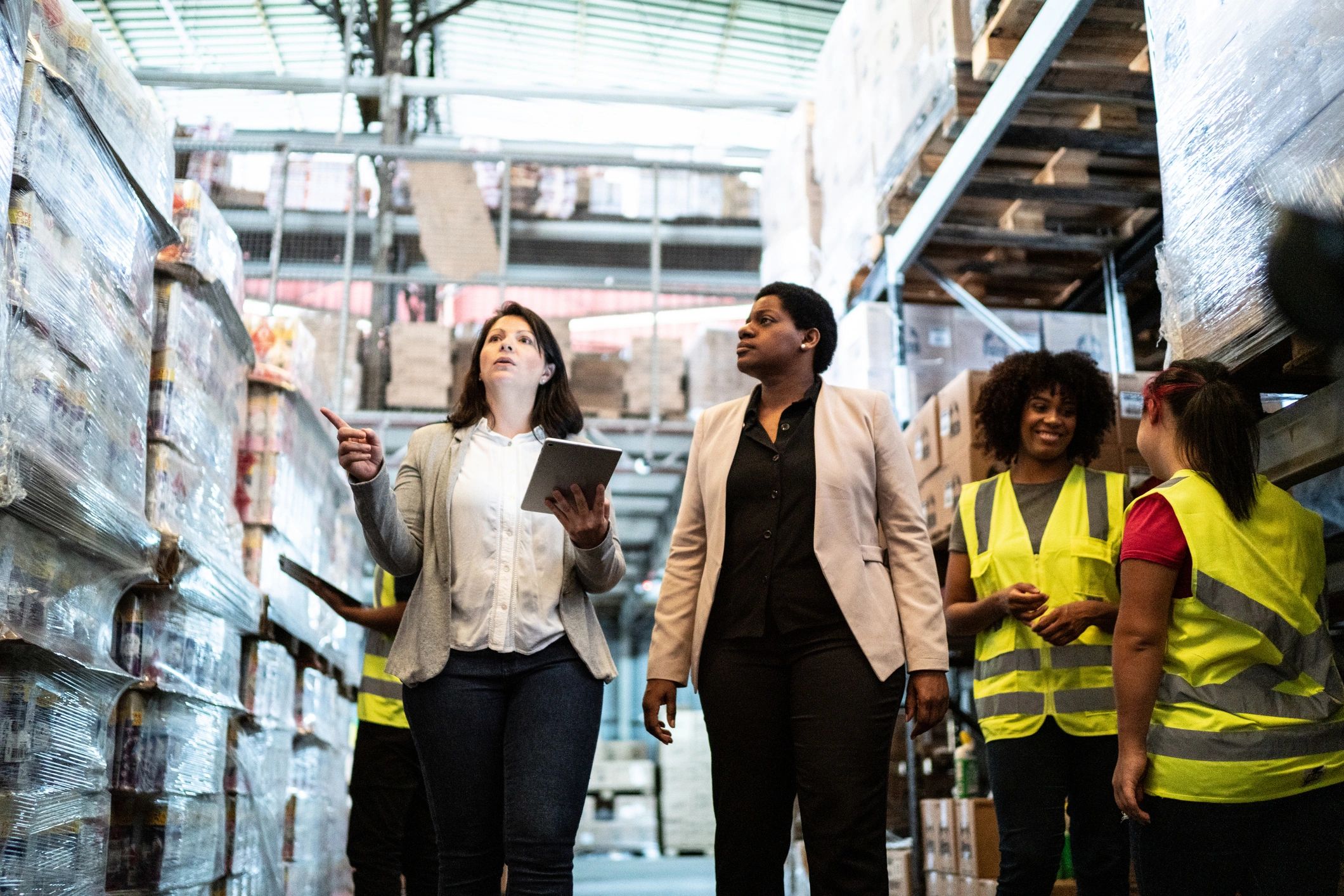 Skycart team members walking through a warehouse
